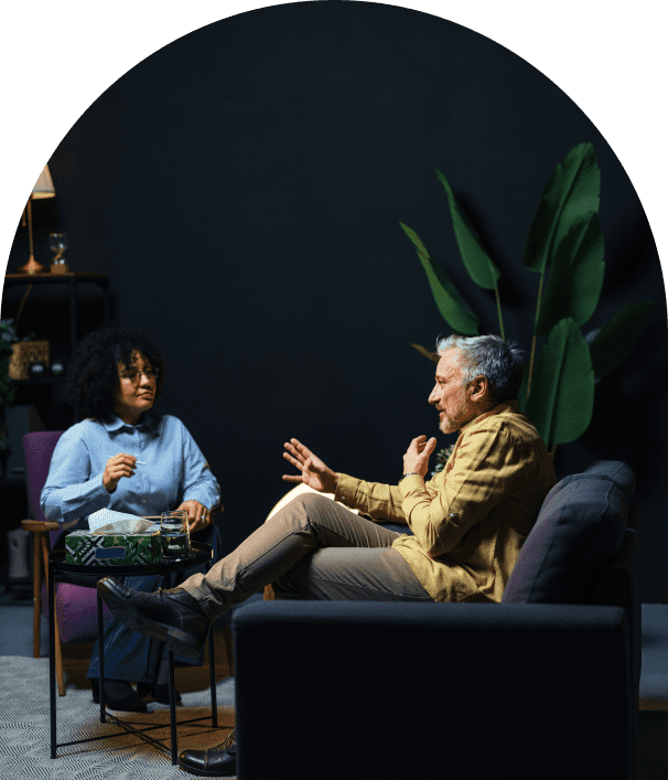 Two people talking in a modern room.